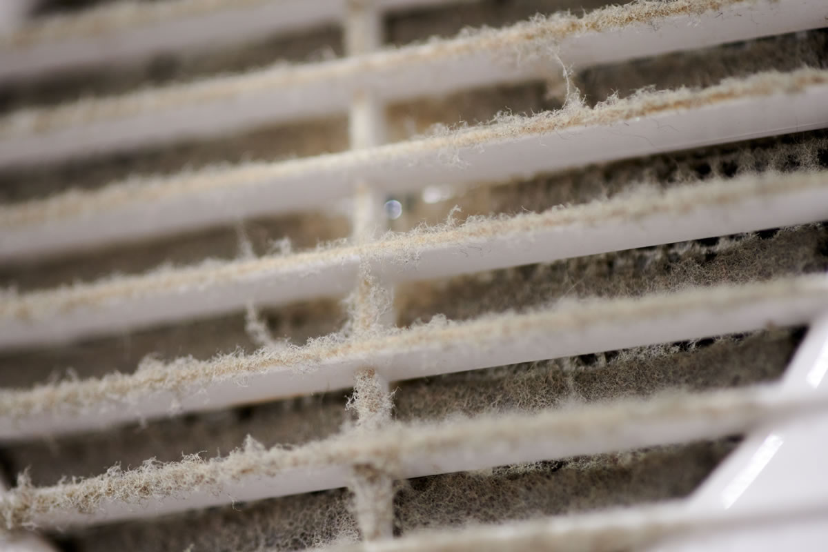 Dirty HVAC air ventilation grille with dusty, clogged filter Dirty HVAC air ventilation grille with dusty, clogged filter
