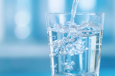 What is backflow and how can it affect water quality?
