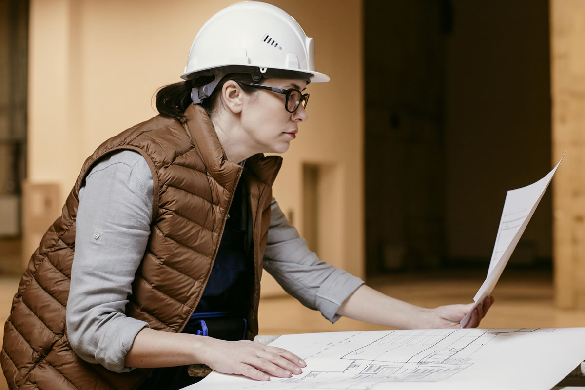 Legionella risk assessor reviewing schematic drawings as part of survey