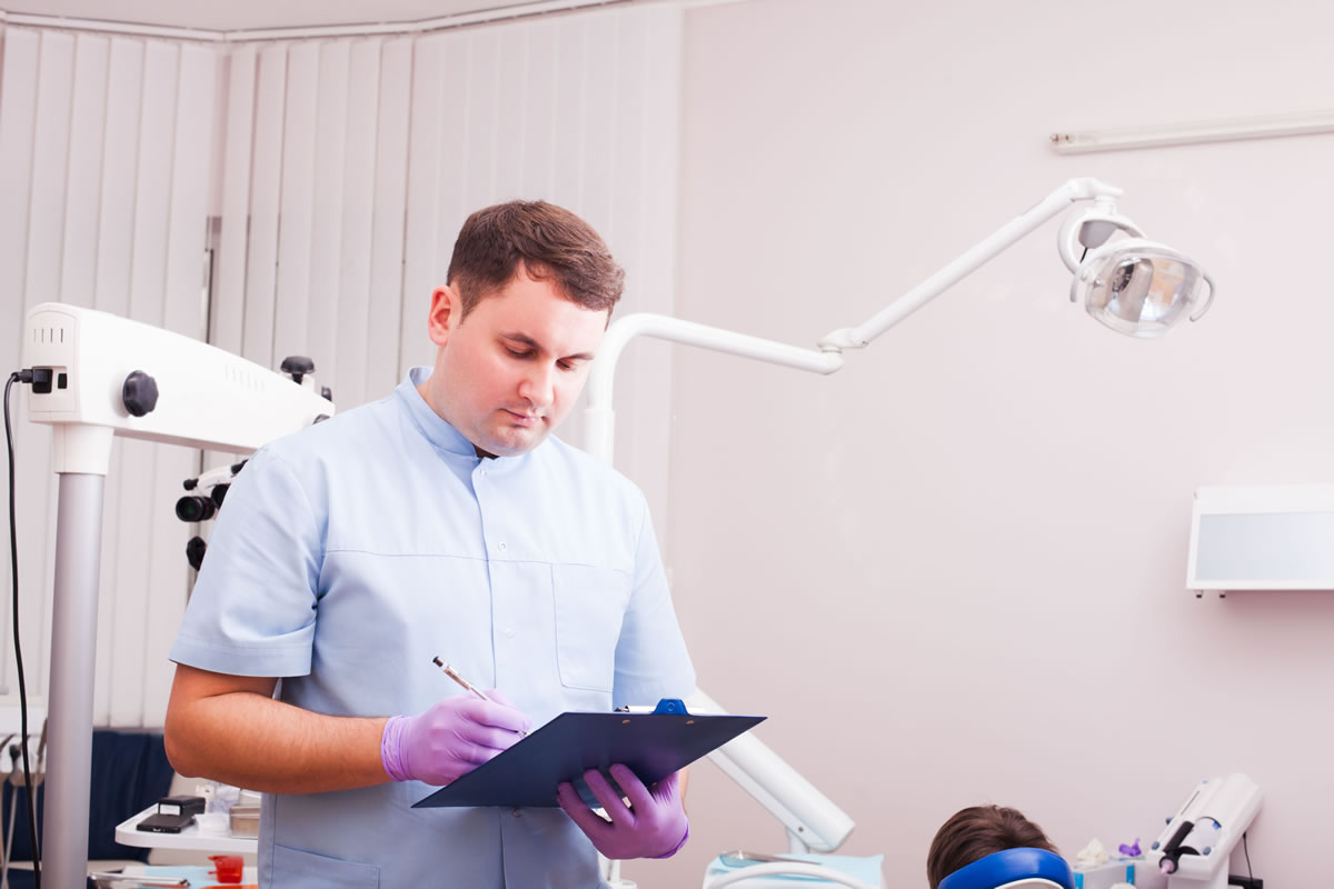 Legionella risk assessor conducting survey of dental practice